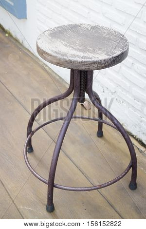 Old wooden outdoor chair on the floor stock photo