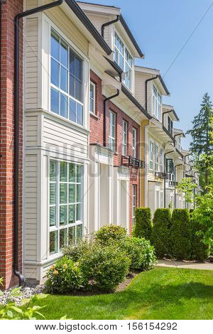 Row of townhouses on a sunny day