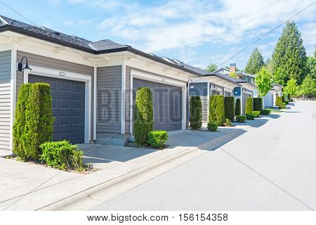 Custom built house in the nice neighbourhood on a sunny day.