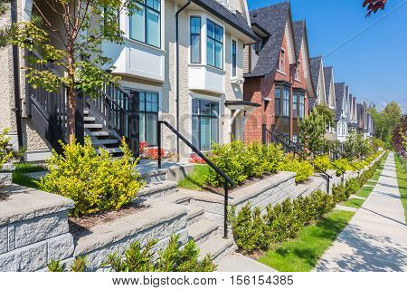 Custom built house in the nice neighbourhood on a sunny day.