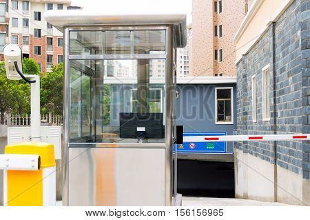 City underground parking garage booth and railings.