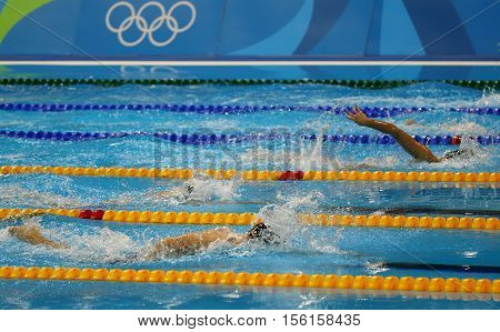 RIO DE JANEIRO, BRAZIL - AUGUST 12, 2016: Free style swimmers compete at the Women's 800m freestyle of the Rio 2016 Olympic Games at the Olympic Aquatics Stadium