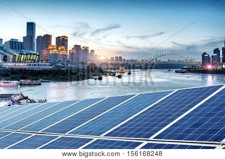 cityscape and skyline of downtown near water of chongqing at night
