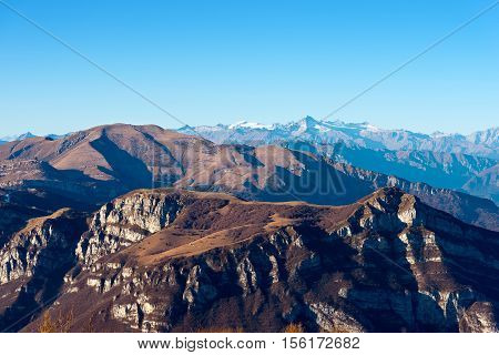 Italian alps in Veneto and Trentino. In the foreground the Monte Baldo (Baldo Mountain) and in the background the group of Adamello seen from the plateau of lessinia
