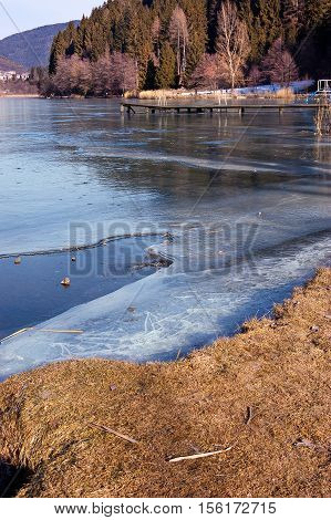 Lago di Serraia (Serraia lake) frozen in winter. Baselga di Pine Trentino Alto Adige Italy