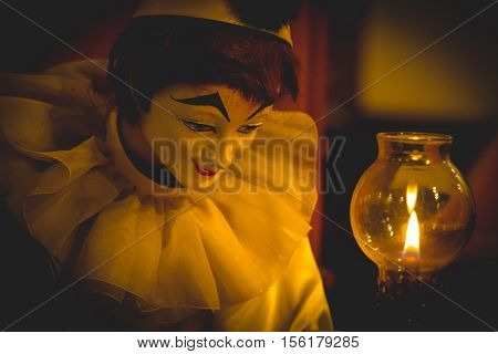 Bozo Doll Hold Quill Pen And Light Of Lamp