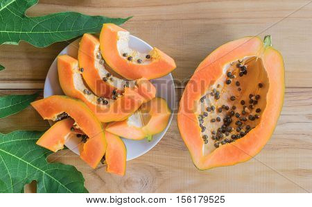 Ripe Papaya On Wood Table From Above , Ripe Papaya Health Benefits.