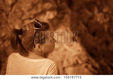 Girl on a hill in the desert. Ordinary people. Effect - Sepia. Nature Monument -Kamyshinskye Mountain Ears. Volgograd region Russia