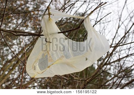 Scattered not sorted packets are carried by wind and swallowed animals and birds. Environmental pollution