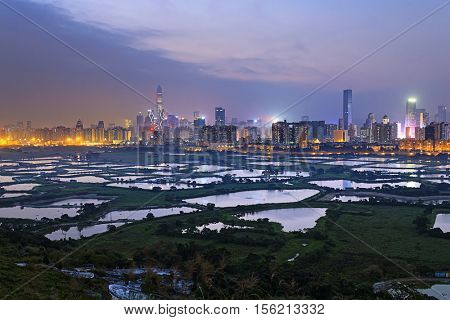 Shenzhen citscape at night , view from hiong kong countryside