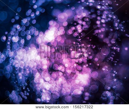 Blue violet bokeh abstract light background .
