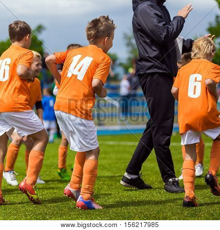 Young Fooball Players Training and Warming Up Before the Final Football Game