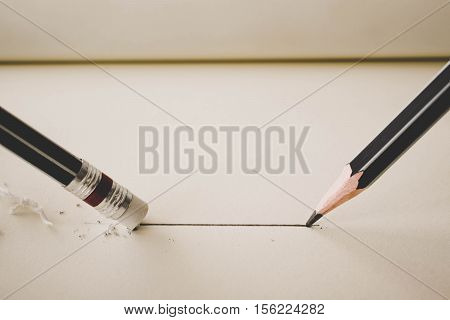 Pencil Draws A Straight Line On Paper And Pencil Eraser Removing Stripe. Business Breaking Concept.