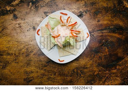 Shrimp cocktail. Overhead takes. Background of wood