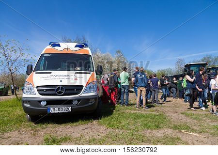 GRIMMEN / GERMANY - MAY 5 2016: german ambulance vehicle stands on tractor show in grimmen / germany at may 5 2016.