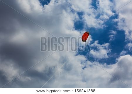 Orange kite in the sky and cloud