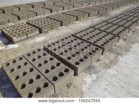 Cinder Blocks Lie On The Ground And Dried. On Cinder Block Production Plant.