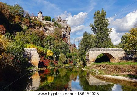 Lacave, France, October 18, 2016: broken bridge and castle near Lacave in France.