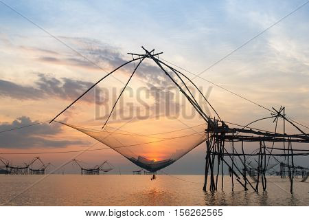 Sunrise at the fisherman village and long tail wooden boat Pattalung Thailand