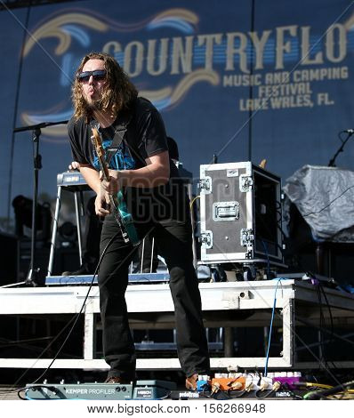 LAKE WALES, FL-NOV 4: Bass player Johnny Stanton of the Josh Thompson band performs at the CountryFlo Music and Camping Festival on November 4, 2016 in Lake Wales, Florida.