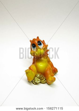 object isolated small statuette of little dragon on a white background