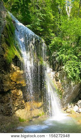 waterfall on a mountain river in the forest