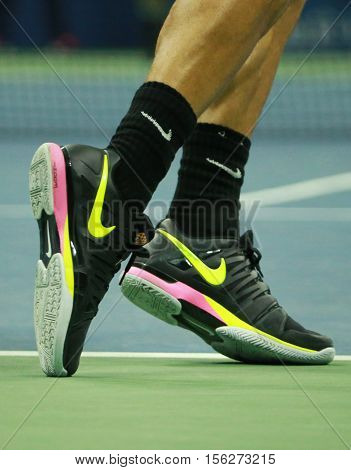 NEW YORK - SEPTEMBER 5, 2016: Professional tennis player Grigor Dimitrov of Bulgaria wears custom Nike tennis shoes  during US Open 2016 round four match at Billie Jean King National Tennis Center
