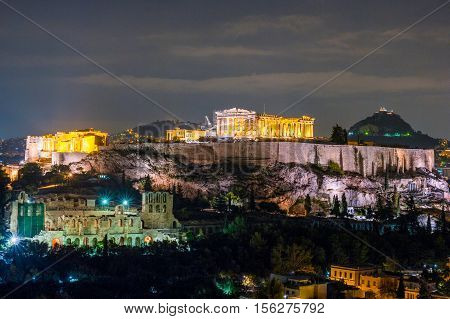Parthenon and Herodium construction in Acropolis Hill in Athens, Greece shot in blue hour with