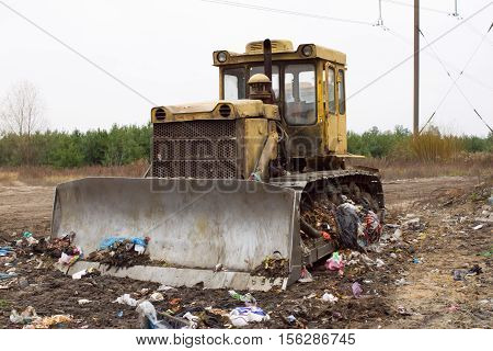 Heavy tracked vehicles generates garbage heap of aborted plastic in landfill outside the city. Waste sorting is required. Lviv city