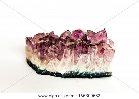 Purple Amethyst precious stone on white background