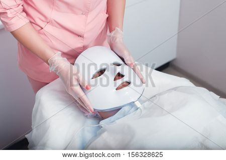 Photodynamic face mask therapy