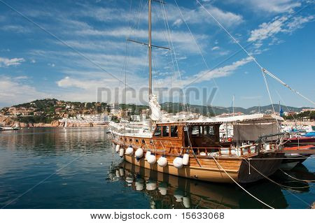 harbor with wooden sailboat in San Feliu de Gauxols
