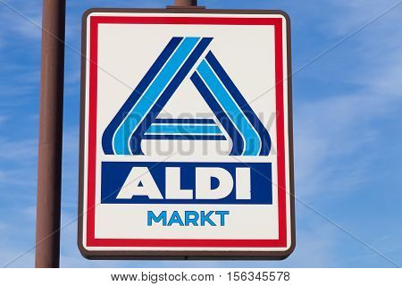 BURG / GERMANY - NOVEMBER 13 2016: Aldi sign against blue sky. Aldi is a leading global discount supermarket chain with almost 10000 stores in 18 countries.