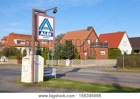 BURG / GERMANY - NOVEMBER 13 2016: Aldi sign against blue sky. Aldi is a leading global discount supermarket chain with almost 10000 stores in 18 countries.
