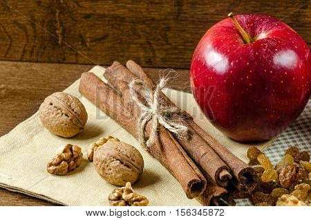 juicy red apples with cinnamon and honey on a napkin