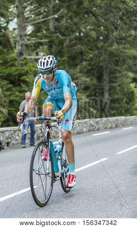 Col du Tourmalet France - July 242014: The Italian cyclist Alessandro Vanotti of Astana Team climbing the difficult road to Col du Tourmalet in Pyrenees Mountains during the stage 18 of Le Tour de France 2014.