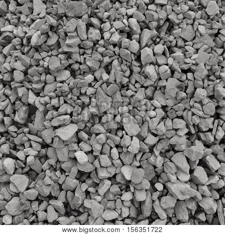 Abstract grey and beige gravel stone background, crushed gray stones and granite pieces texture, large detailed horizontal textured rough construction rock material mix pattern