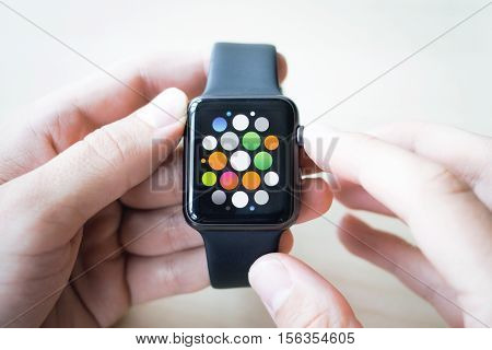 Black smart watches in the hands of