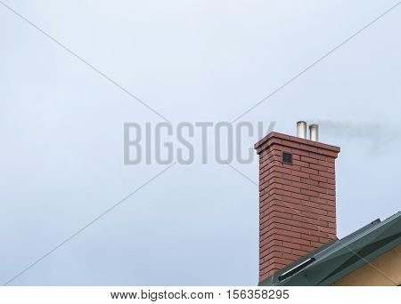 House Chimney With Flying Smoke