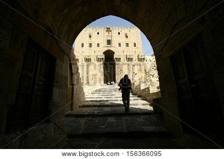 ALEPPO, SYRIA-OCTOBER 12 :Unidentified people in the Citadel of Aleppo. Medieval fortified palace in the old city of Aleppo in Syria on October 12, 2007. UNESCO World Heritage Site since 1986.