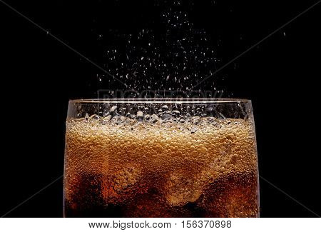 Ice Cola With Splashing Co Bubbles.