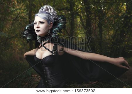 Woman causeth horror and fear she in a black dress.