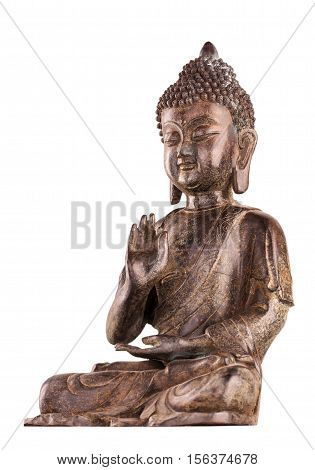 Buddha Shakyamuni's figure in a manual pose - vitarka mudra. The old statue made of metal isolated on a white background.