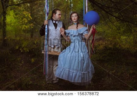 Guy and girl in the forest they are in retro style.