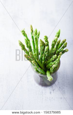 Bundle of fresh green asparagus on the table