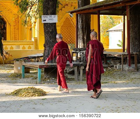 Buddhist Monks Walking At Shwedagon Pagoda