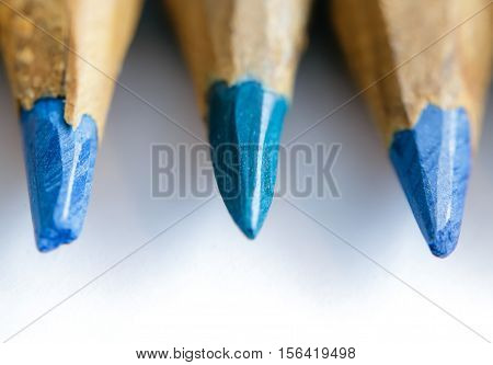 Colored pencils sharpened by hand closeup. Selective focus
