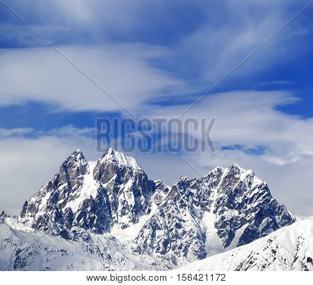 Mounts Ushba And Chatyn And Blue Sky With Clouds In Winter Wind Day
