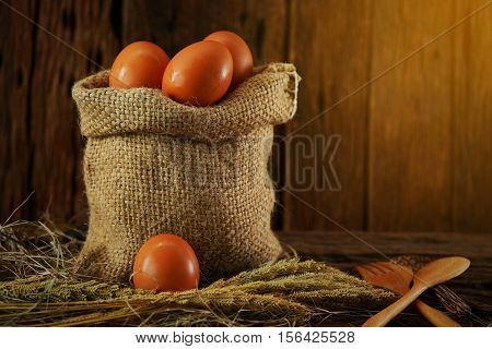 Fresh eggs on wooden background from farm and prepare for cook in kitchen room, Organic food and clean food for healthy, Eggs from farm to the market for raw material to cooking by chef in restaurant.