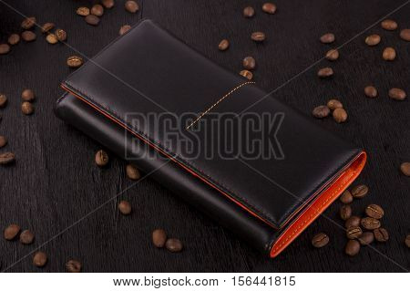 leather female purse on a wooden background